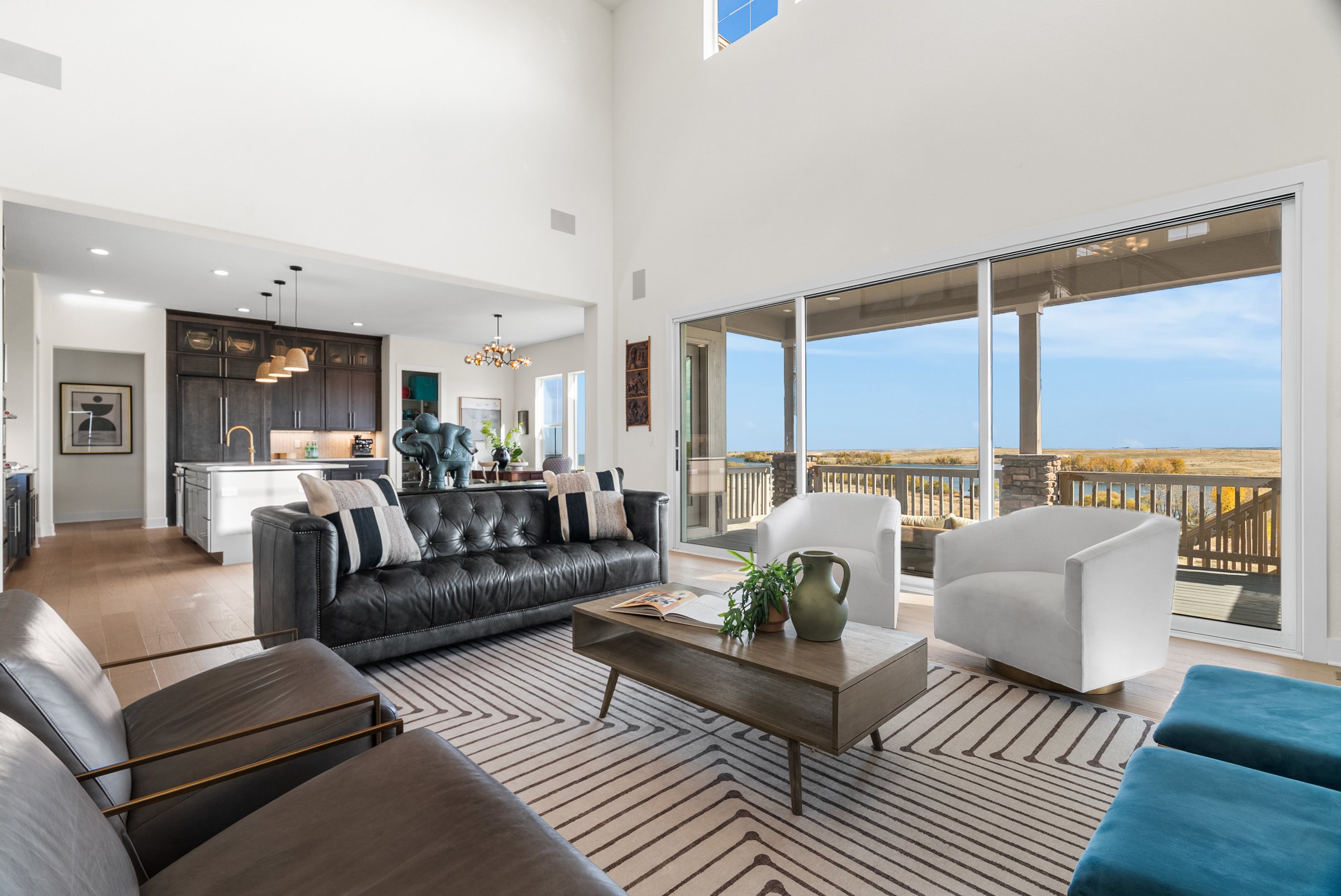 Open great room with panoramic sliding glass and protected view.