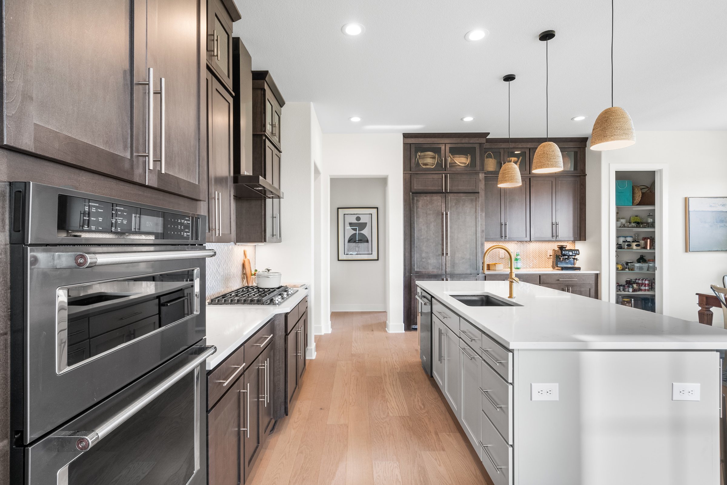 Kitchen range wall, island, and cabinetry detail.
