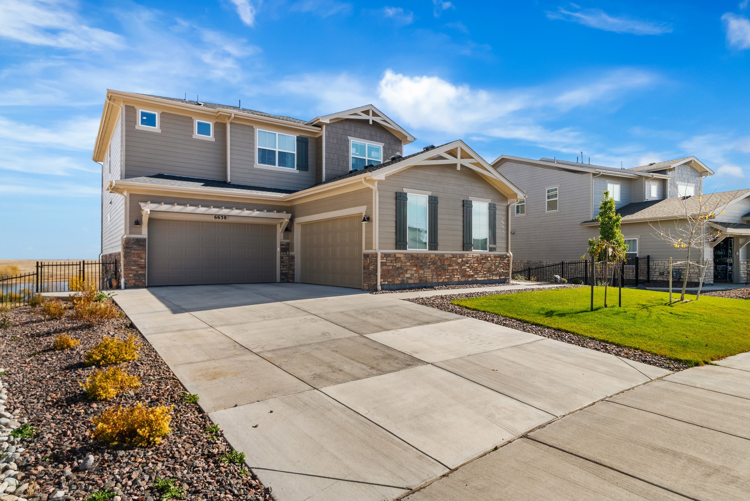 Daytime front exterior and driveway.